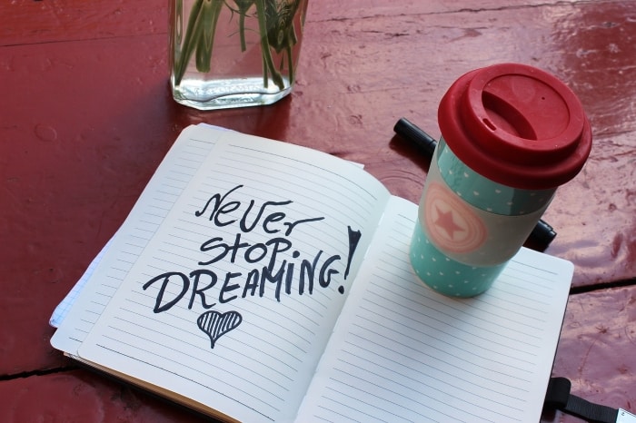 Message in a notebook: "Never stop dreaming!" - from personal development to spirituality